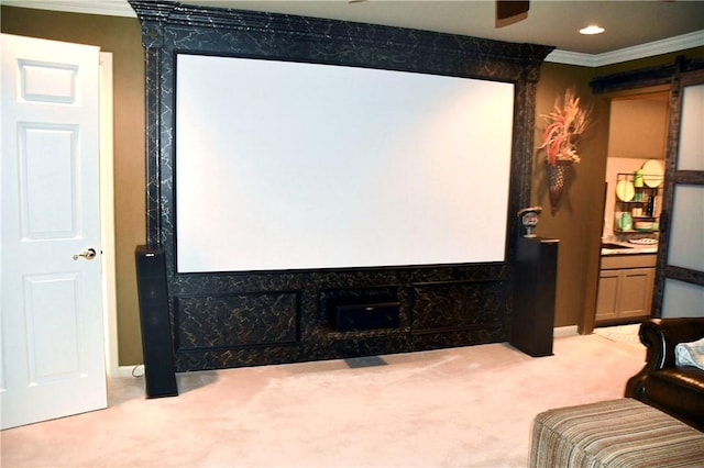 cinema room with light colored carpet and crown molding