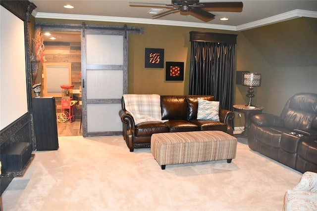 carpeted living room featuring crown molding, a ceiling fan, recessed lighting, and a barn door