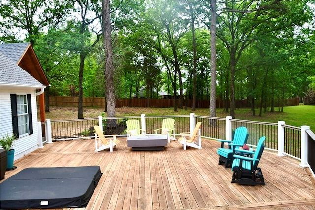 deck featuring a yard and a fenced backyard