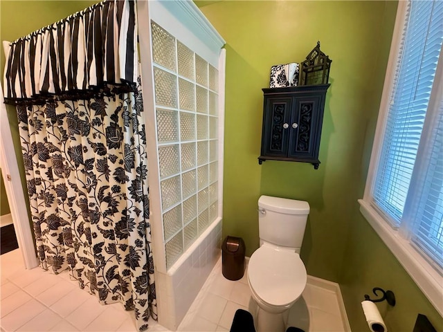 bathroom with tile patterned floors and toilet