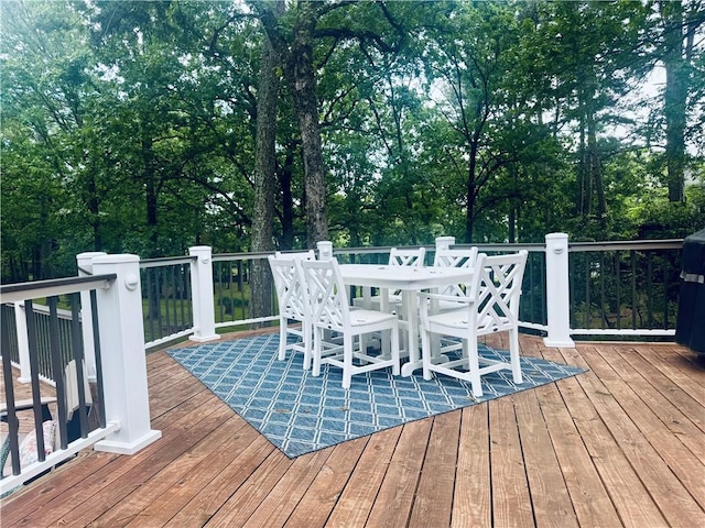 wooden deck with outdoor dining space