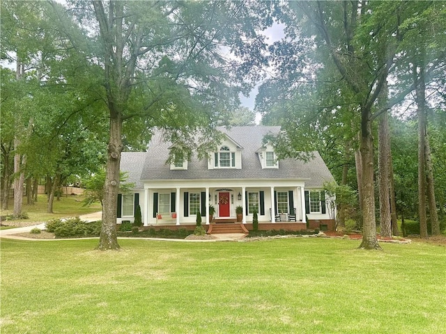 cape cod house featuring covered porch and a front yard