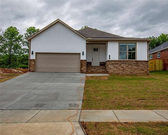 single story home featuring a garage, a front yard, brick siding, board and batten siding, and concrete driveway