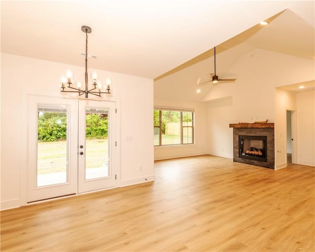 interior space featuring baseboards, visible vents, light wood finished floors, and a fireplace