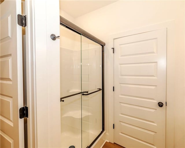 full bath featuring a shower stall