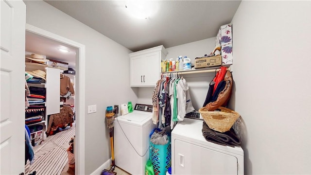laundry area with cabinet space and washing machine and clothes dryer