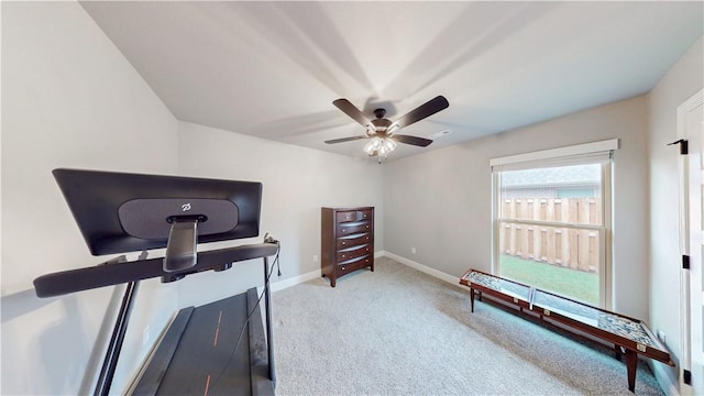 workout area featuring baseboards, carpet flooring, and ceiling fan