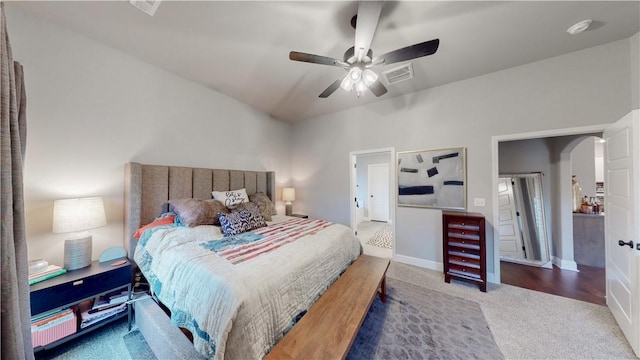 bedroom featuring visible vents, a ceiling fan, baseboards, arched walkways, and carpet