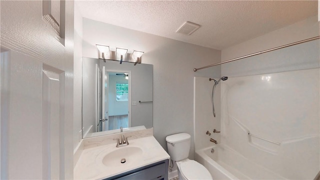 full bathroom featuring vanity, visible vents, toilet, bathtub / shower combination, and a textured ceiling