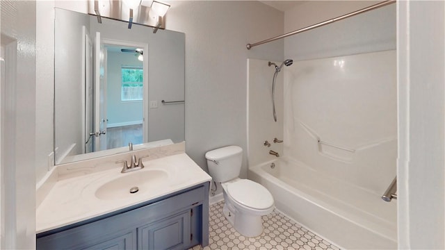 bathroom with vanity, tile patterned flooring, bathtub / shower combination, and toilet