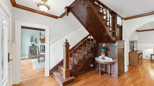 1100 N Lowell Rd, Springdale, AR 72784 - staircase with arched walkways, ornamental molding, baseboards, and wood finished floors