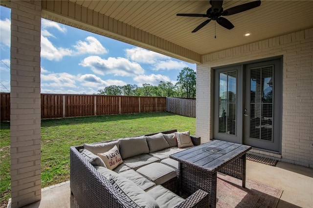 view of patio with a fenced backyard, ceiling fan, and outdoor lounge area