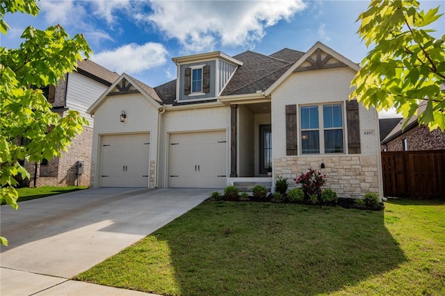 view of front of property with fence, driveway, brick siding, and a front yard