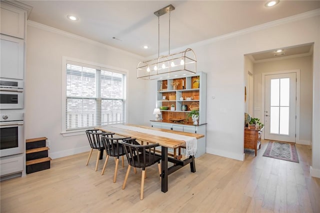 dining space featuring light wood-style floors and recessed lighting