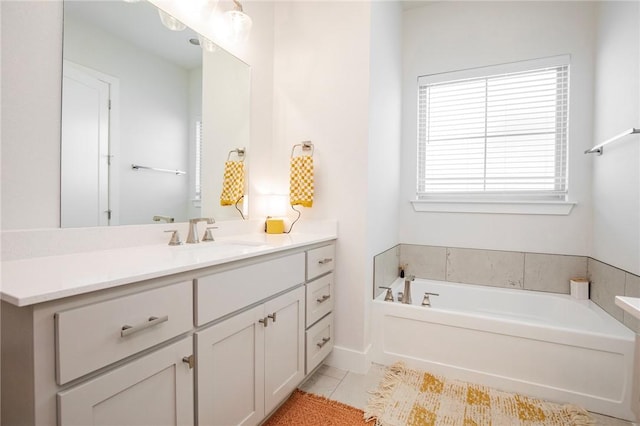 full bath with a garden tub, tile patterned flooring, and vanity