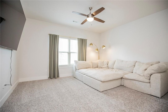 carpeted living room with visible vents, baseboards, and ceiling fan