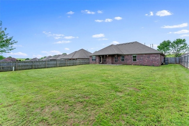 view of yard with a fenced backyard