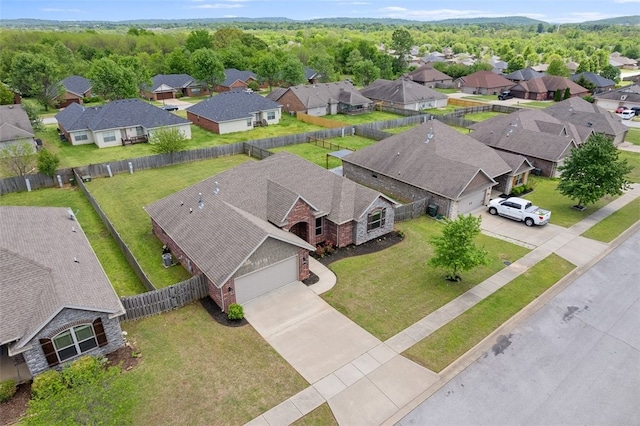 birds eye view of property with a residential view