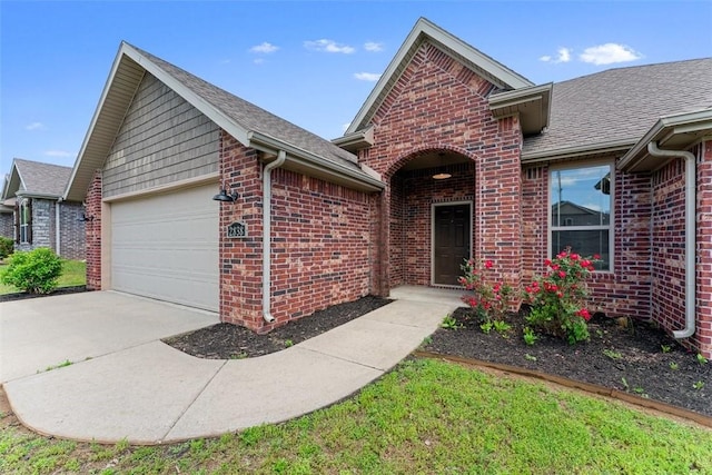 single story home featuring brick siding, an attached garage, roof with shingles, and driveway