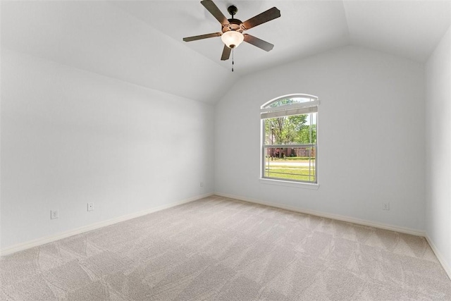 unfurnished room featuring baseboards, carpet flooring, ceiling fan, and lofted ceiling
