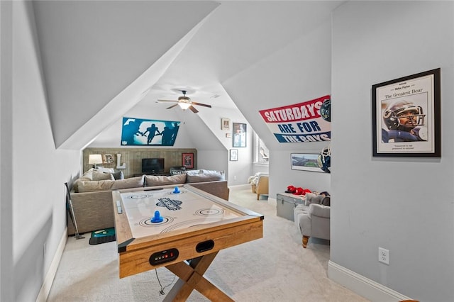 playroom featuring carpet flooring, a ceiling fan, baseboards, and lofted ceiling