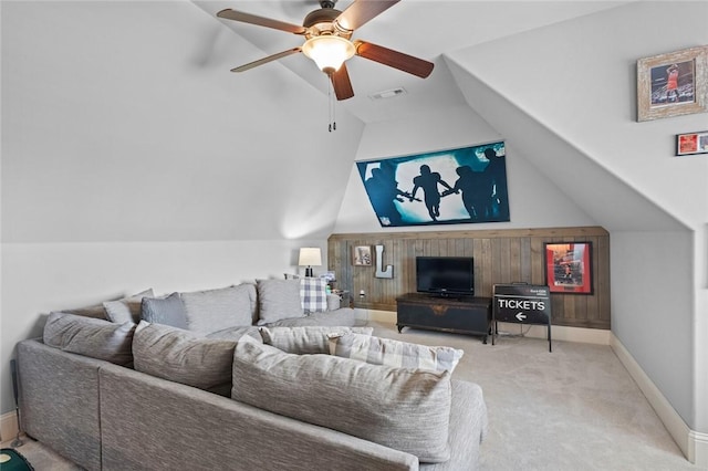 living room featuring ceiling fan, visible vents, carpet, baseboards, and vaulted ceiling