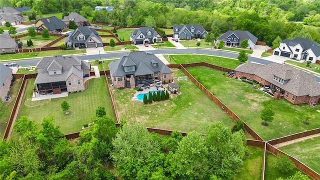 birds eye view of property with a residential view