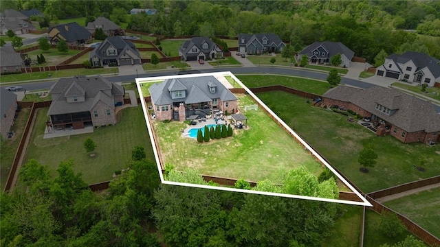 birds eye view of property with a residential view
