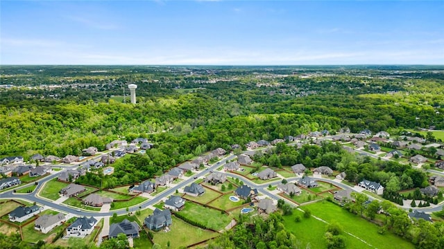 aerial view featuring a view of trees and a residential view