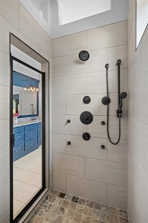 bathroom featuring vanity and a tile shower