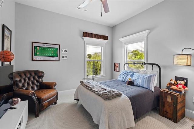 bedroom with carpet floors, a ceiling fan, baseboards, and visible vents