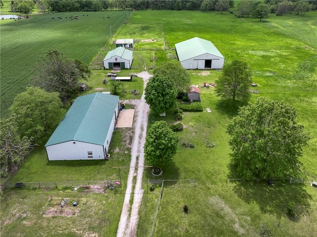 birds eye view of property with a rural view