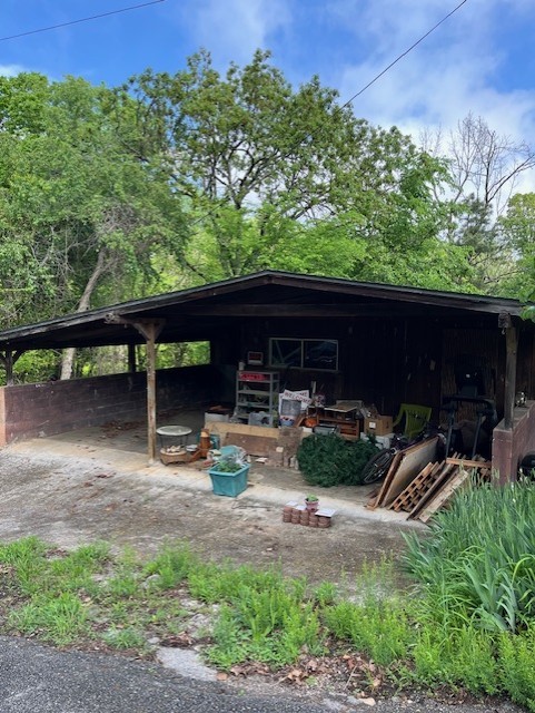 exterior space with a carport