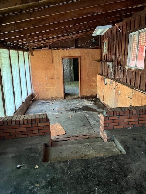 miscellaneous room with wood walls