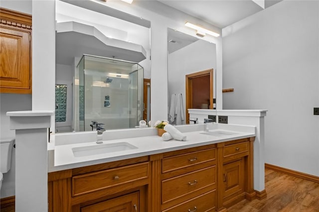 10 Spring Valley Dr, Bentonville, AR 72712 - full bath featuring wood finished floors, toilet, a sink, and a stall shower