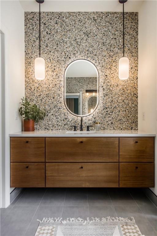 bathroom with decorative backsplash, tile patterned floors, and vanity