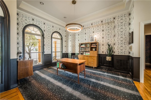 office area featuring ornamental molding, wood finished floors, a wainscoted wall, and wallpapered walls