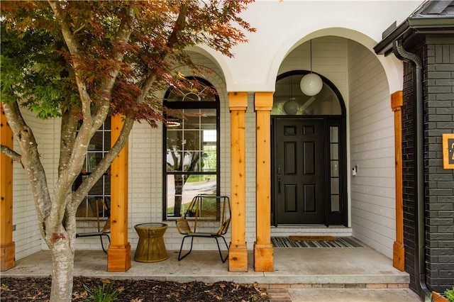 property entrance with brick siding