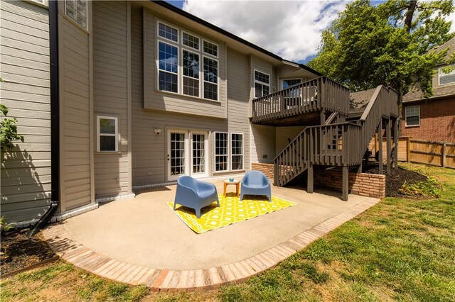 back of house with a patio, a wooden deck, and stairs