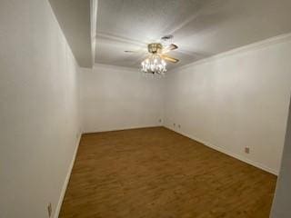 6 Briarwood Ln, Clarksville, AR 72830 - spare room with a chandelier, wood finished floors, ornamental molding, and baseboards