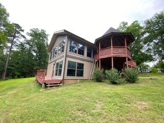 6 Briarwood Ln, Clarksville, AR 72830 - rear view of house with a lawn and a deck