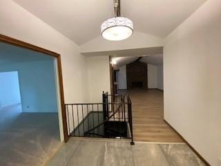 6 Briarwood Ln, Clarksville, AR 72830 - corridor featuring an upstairs landing and lofted ceiling