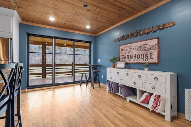 bedroom featuring access to outside, baseboards, wood ceiling, and wood finished floors