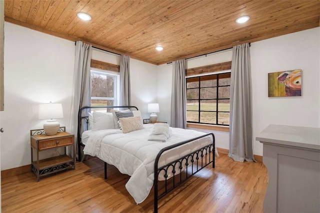 bedroom with recessed lighting, baseboards, wood ceiling, and light wood-type flooring