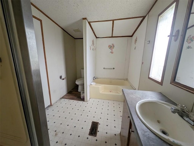 12346 Riggs Ln, Lead Hill, AR 72644 - bathroom with vanity, ornamental molding, toilet, a textured ceiling, and tile patterned floors