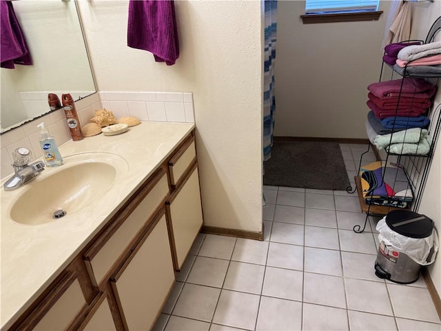 full bathroom featuring vanity, decorative backsplash, a shower with shower curtain, and tile patterned floors