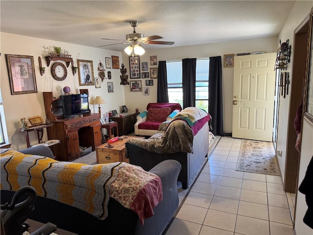 living area featuring ceiling fan and light tile patterned flooring