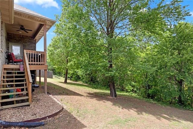 11003 David Ct, Siloam Springs, AR 72761 - view of yard with a deck, ceiling fan, and stairs