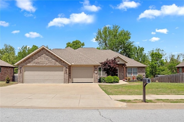 11003 David Ct, Siloam Springs, AR 72761 - single story home with concrete driveway, brick siding, an attached garage, and a front yard