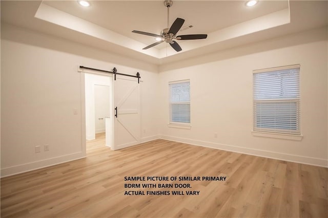 11 Exminster Ln, Bella Vista, AR 72714 - unfurnished room with recessed lighting, baseboards, a tray ceiling, and light wood finished floors